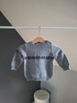 Pull gris à motif