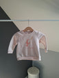 Pull rose licorne